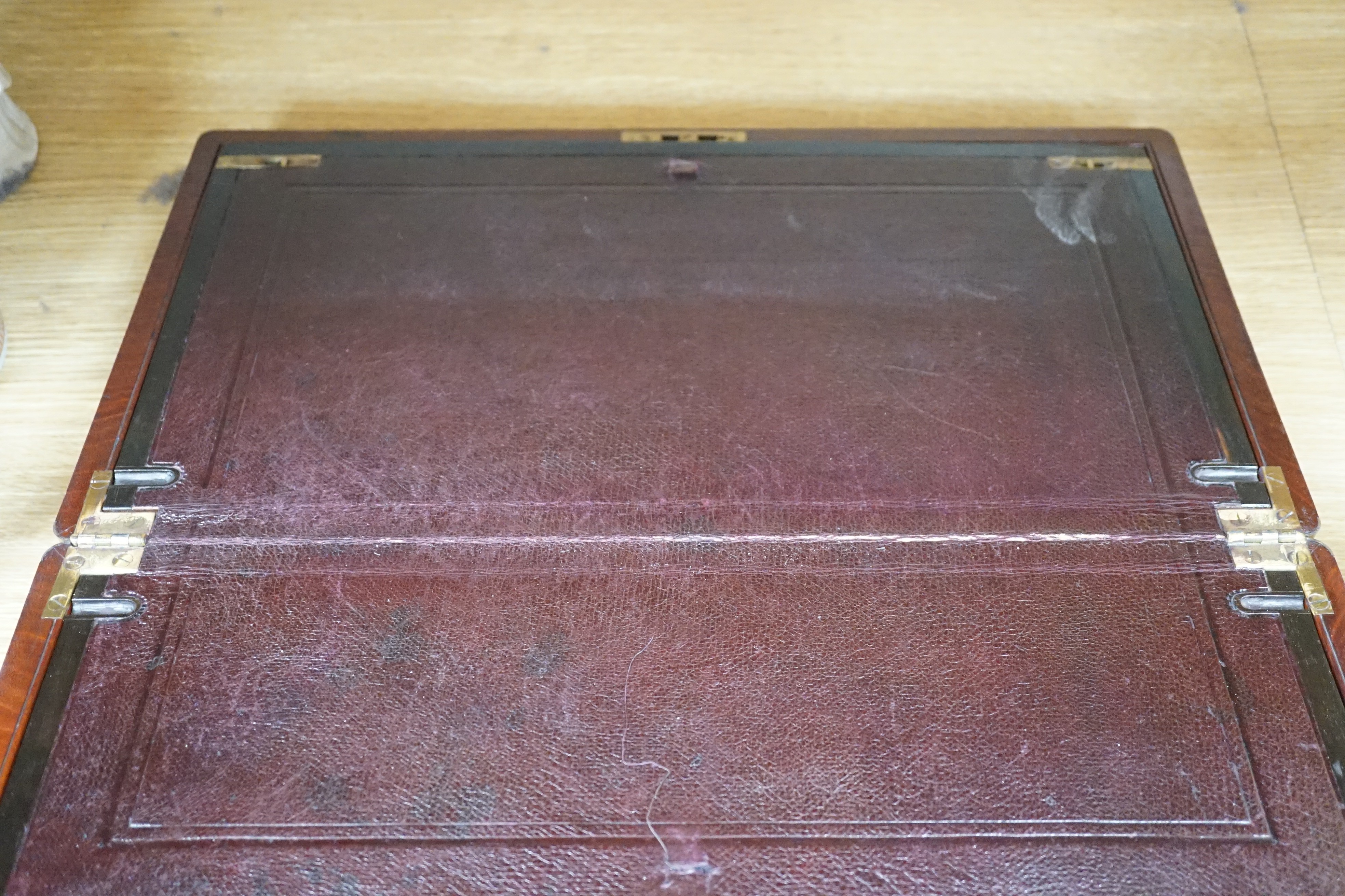 A brass inlaid mahogany writing slope, Coromandel covers to interior, 49cm wide